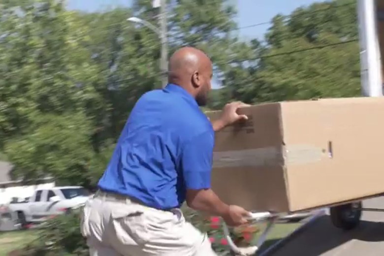 Carrying boxes out on the hand truck